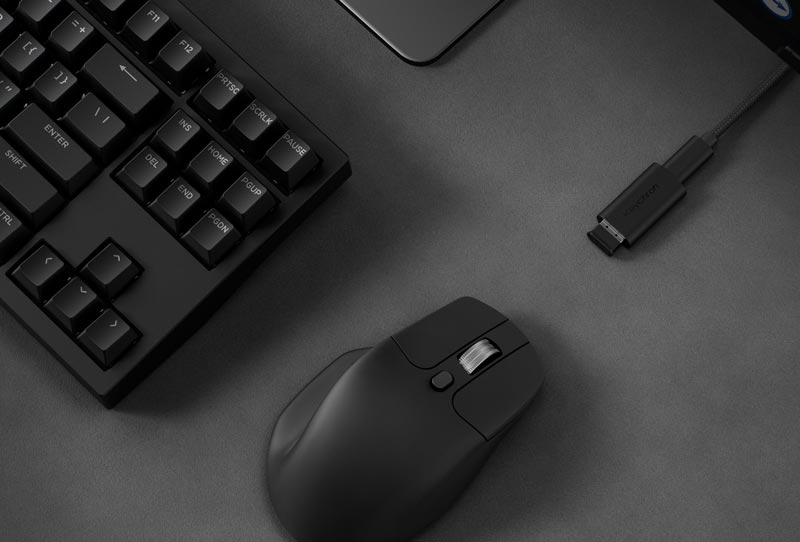Black Keychron M6 Premium Wheel beside a keyboard and receiver extension