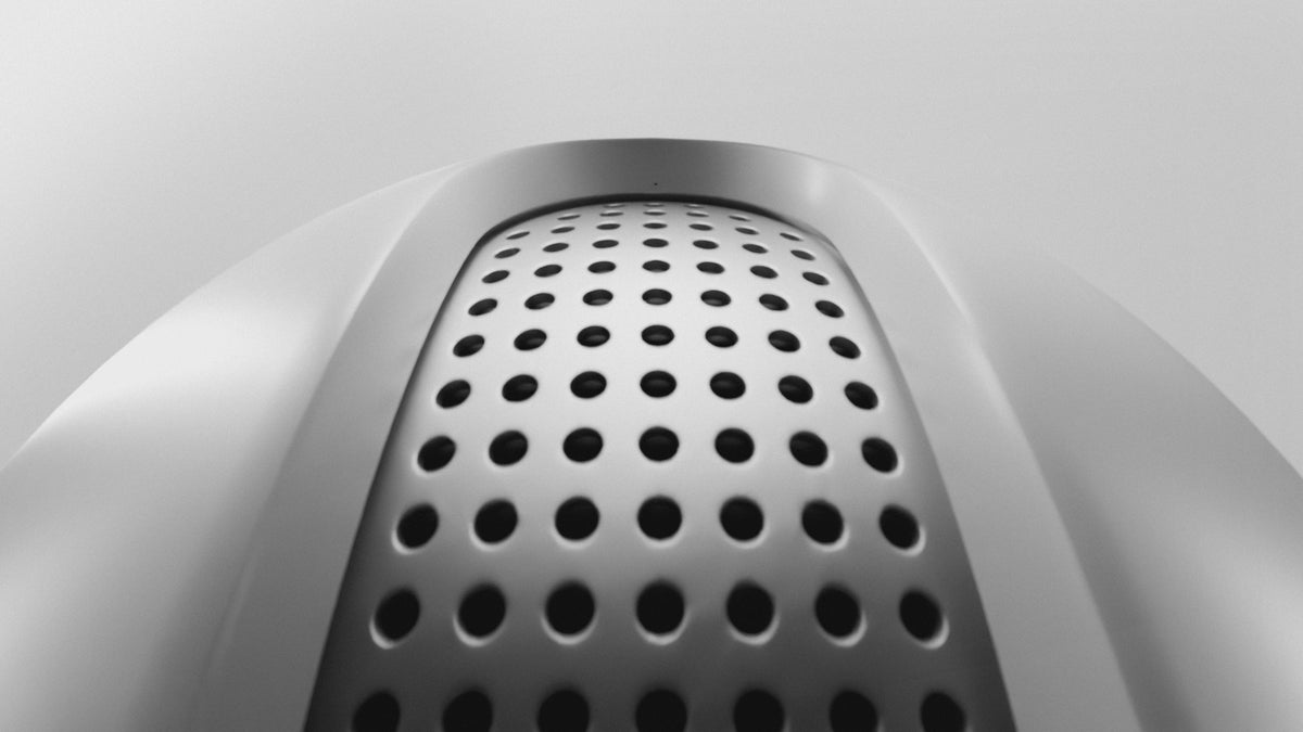 A close-up of an earbud followed by an animation of its three-point clip fit