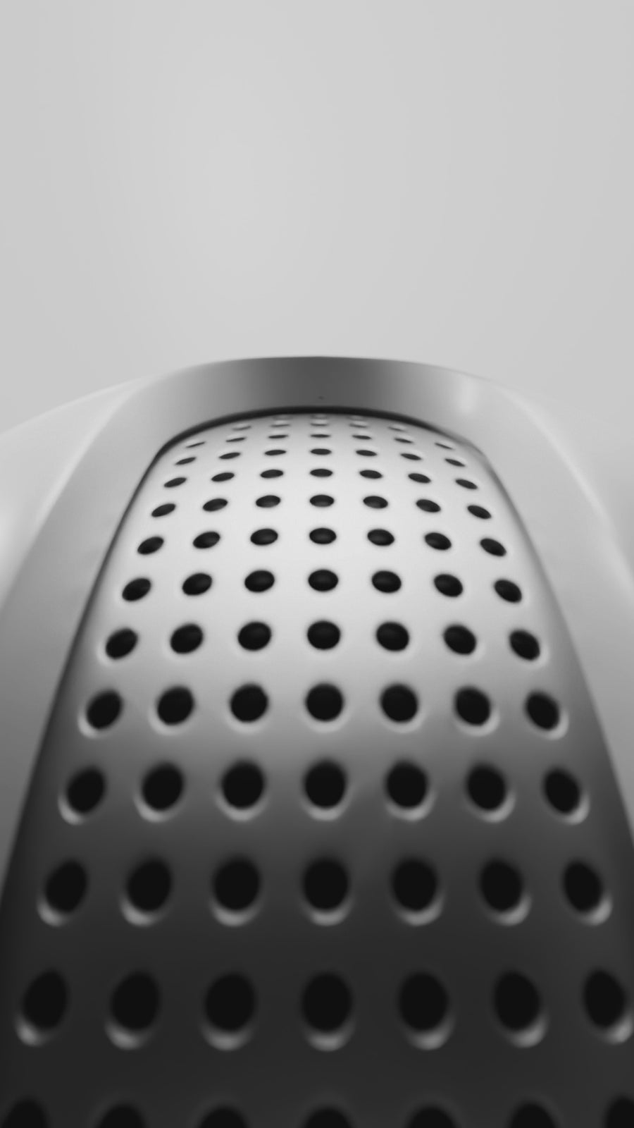 A vertical close-up of an earbud followed by an animation of its three-point clip fit