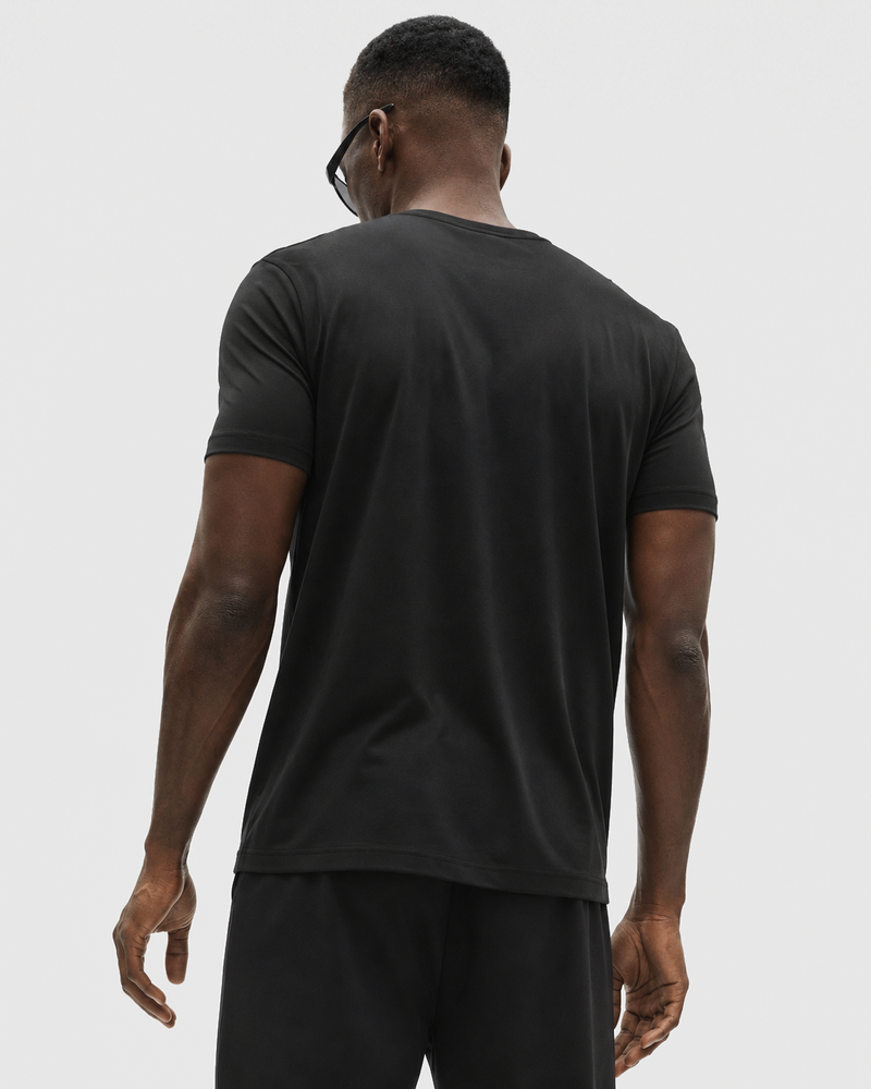 Rear view of the Black Relaxed Tee, showing the shoulder seams and straight hem.