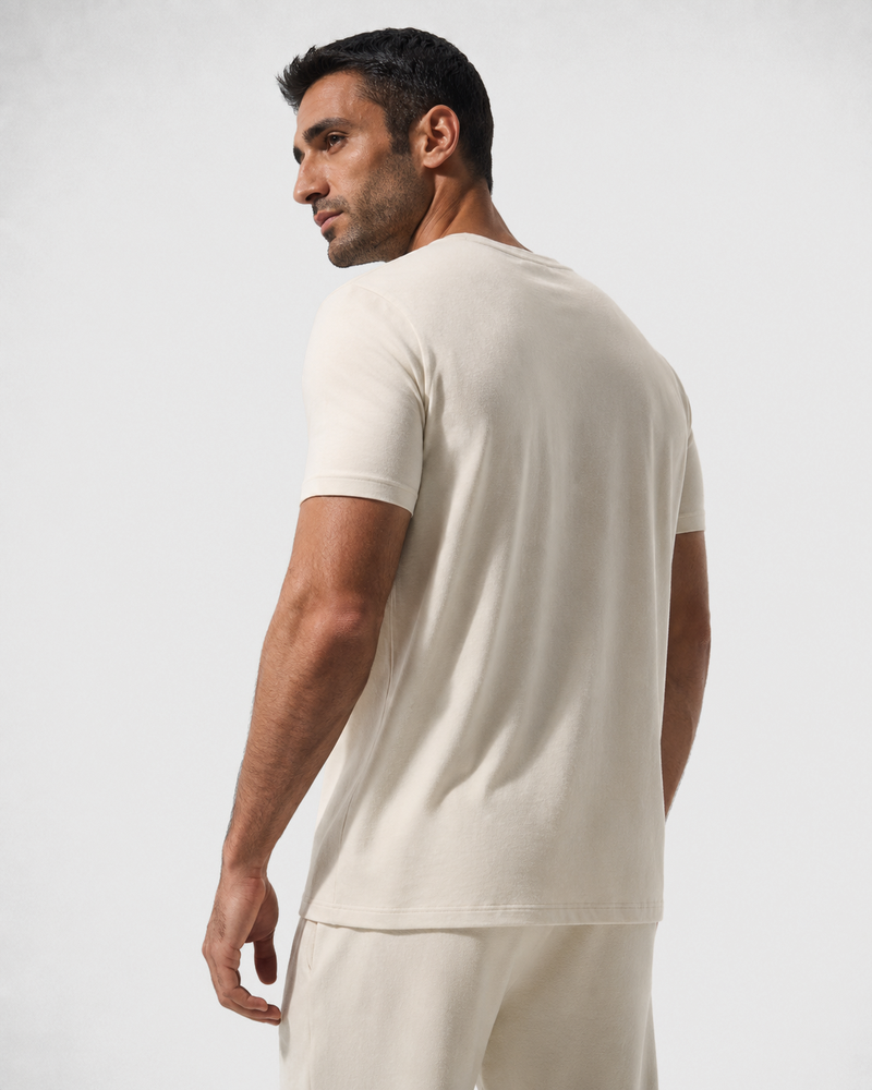 Rear three-quarter view of the Ivory Relaxed Tee, showing its straight hem and shoulder seams.