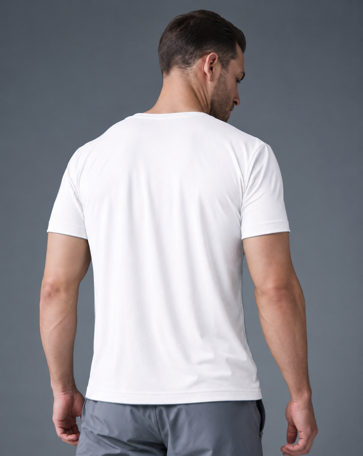 Rear view of the White Relaxed Tee, showing its shoulders, sleeves and hem.