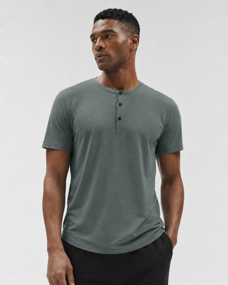 Front view of the Bamboo green Henley, showing three snap buttons and a curved hem.