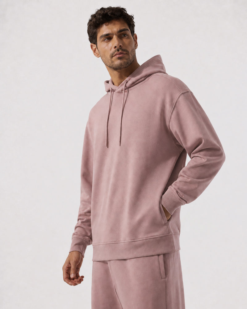 Three-quarter view of the TexTale Rain-Repel Hoodie in Pink Gray with a hand in the front pocket