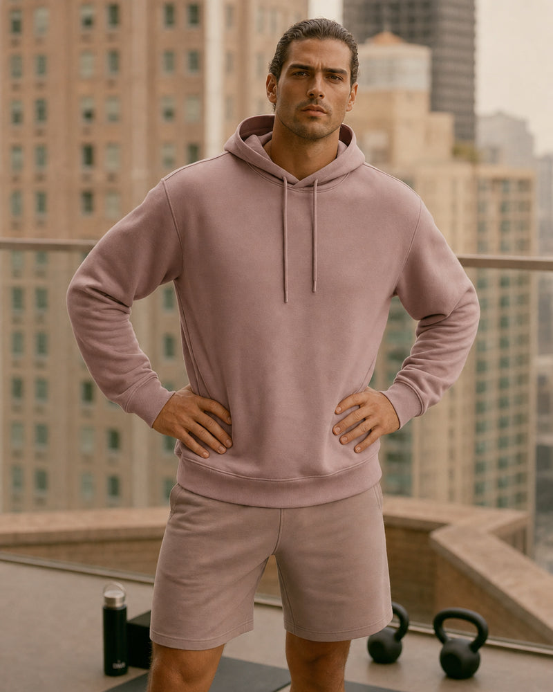 Model outdoors wearing the TexTale Rain-Repel Hoodie in Pink Gray