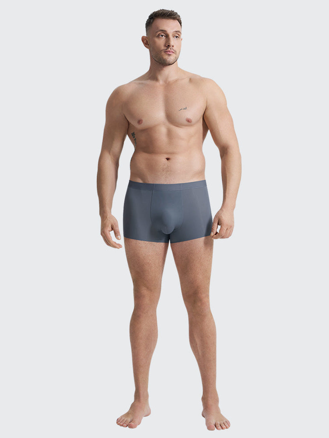 A model standing in the blue-grey Airy Trunk