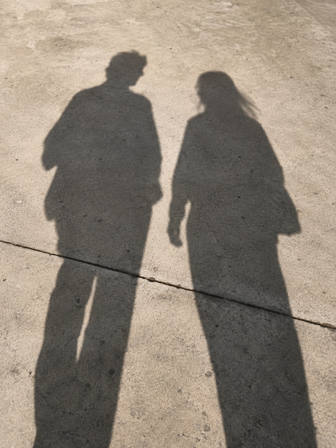 two shadows walking side by side